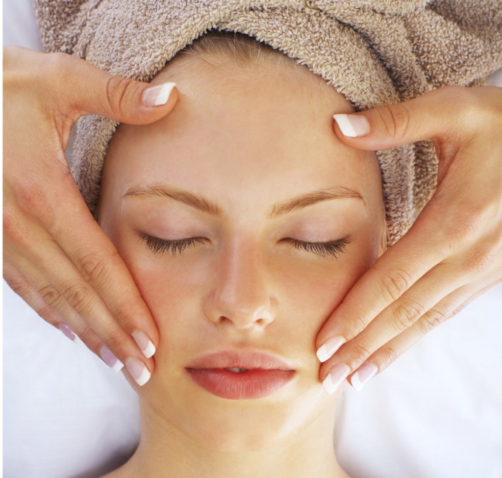 Woman getting a facial massage at a med spa