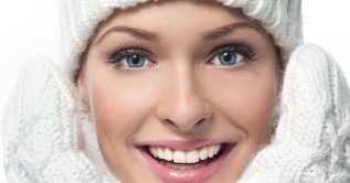 women dressed in winter hat and mittens smiling
