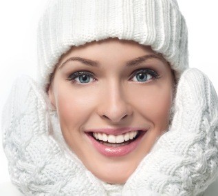 women dressed in winter hat and mittens smiling