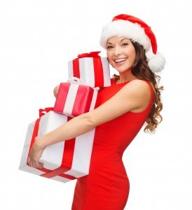 beautiful young woman carrying gift wrapped presents