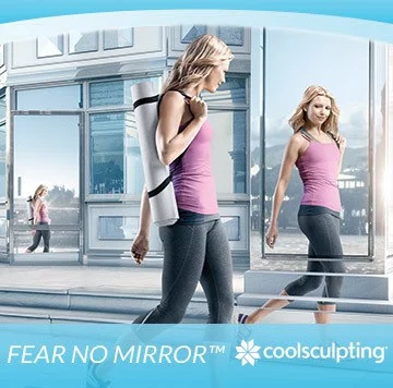 Woman checks herself out in mirror after attending 2015 Coolsculpting Event at Artemedica