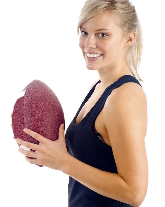 woman holding football in honor of game day specials at artemedica