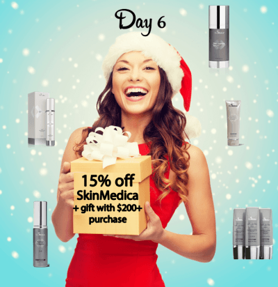 beautiful young woman holding gift wrapped present