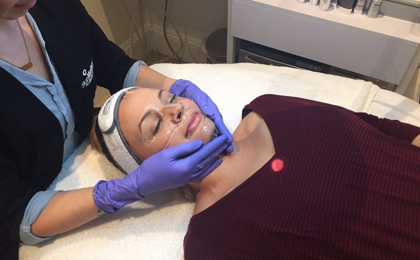 esthetician administering collagen mask