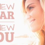 Woman smiling into sunrise with text, "New year new you"