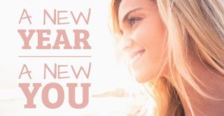 Woman smiling into sunrise with text, "New year new you"