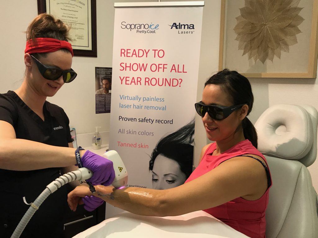 esthetician administering laser resurfacing treatment