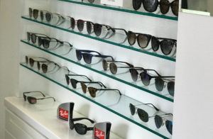 shelves lined with kate spade designer sunglasses