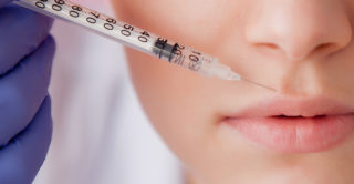 woman receiving botox on her upper lip