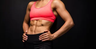 woman's firm and toned abs after receiving cooltone treatment
