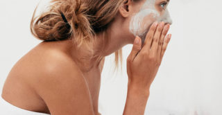 Woman enjoying a mini exfoliating facial from Artemedica at home