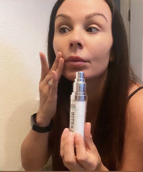 Kara applying restorative skin complex