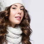 Young women dressed in winter clothing with beautiful and flawless skin