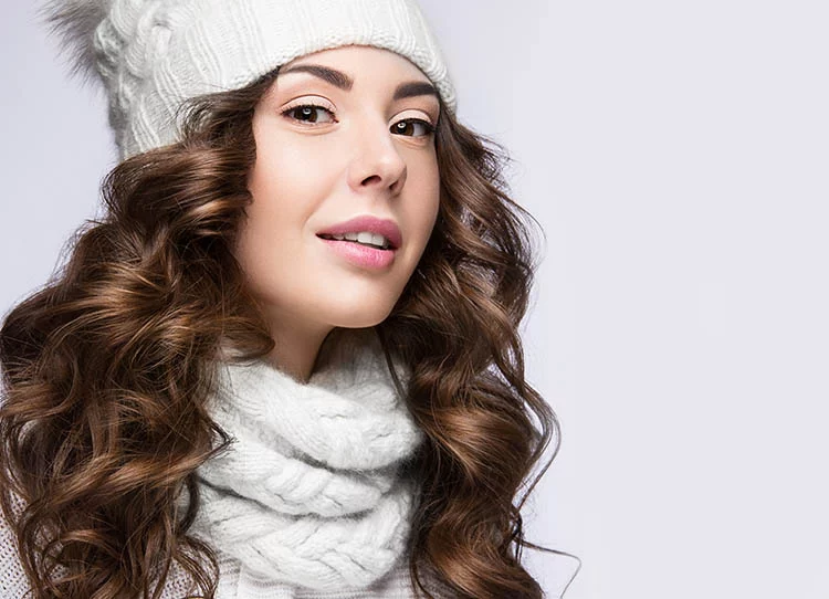 Young women dressed in winter clothing with beautiful and flawless skin