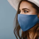 Woman wearing stylish protective face mask