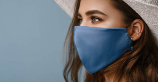 Woman wearing stylish protective face mask