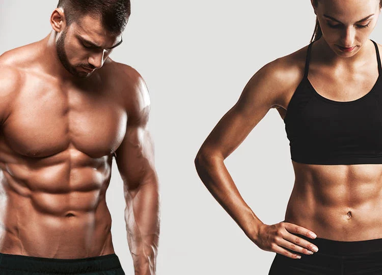 Portrait of sporty young man and woman with muscular body, posing against a gray background