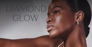diamond glow logo overlay a beautiful dark skined women with perfect skin