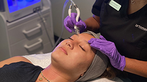 Artemedica client receiving diamond glow facial