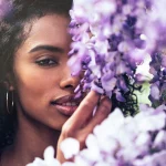Beautiful young women surrounded by flowers