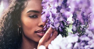 Beautiful young women surrounded by flowers