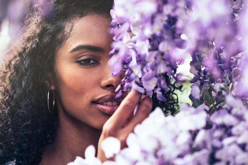 Beautiful young women surrounded by flowers