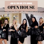 Seven Artemedica staff members dressed in black dresses standing under an outdoor event tent holding multiply Open House goodie bags with an overlay message that reads, "Join Us for Our 12th Annual Open House October 6th".