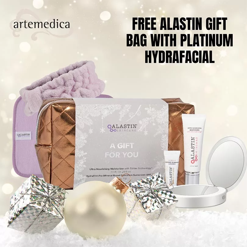 Alastin gift bag on holiday background with : "FREE ALASTIN GIFT BAG WITH PLATINUM HYDRAFACIAL"