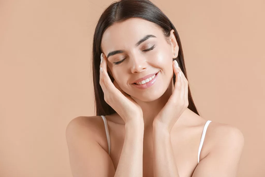 A young woman enjoys healthy, glowing skin after a TCA 'no peel' facial treatment.