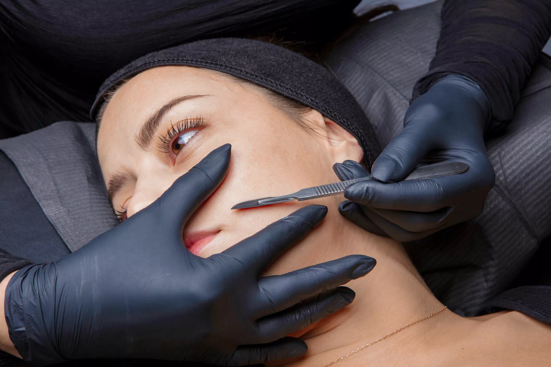 woman receiving professional dermaplaning treatment at a medical spa