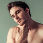 A handsome man, green background