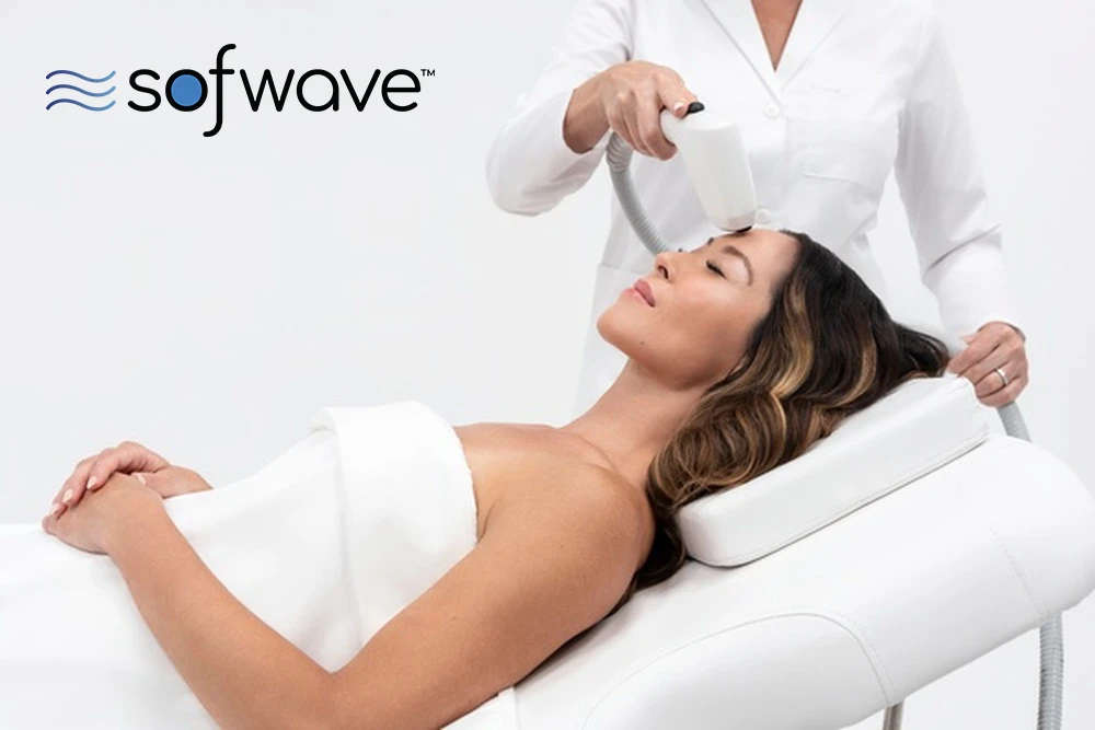 A women at a med spa receiving Sofwave skin rejuvenation to treat forehead wrinkles