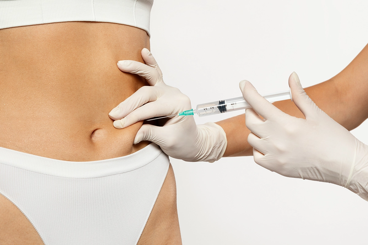 A person receiving skinny shot GLP-1 weight loss injections, against a white background